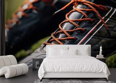 A close-up of a pair of soccer cleats laces tightly tied ready to hit the field for the football season kickoff  Wall mural