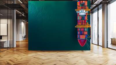 aerial view of a cargo ship loaded with colorful containers at a commercial dock, representing globa Wall mural