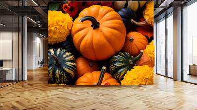 An arrangement of colorful pumpkins and vibrant fall foliage showcasing the bountiful harvest of an autumn farmers market  Wall mural