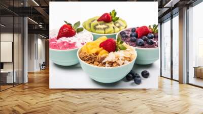 Colorful acai bowls with granola coconut flakes and fruit isolated on a white background  Wall mural