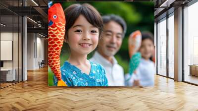 Grandparents and children flying colorful koinobori (carp streamers) together outside in a lush green garden, celebrating tradition and family unity in Japan  Wall mural