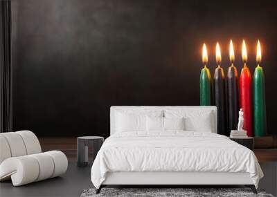 Kwanzaa kinara with vibrant red black and green candles illuminating a festive scene against a dark background  Wall mural