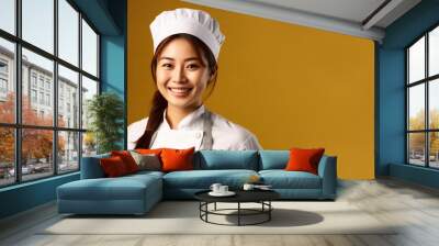 Portrait of smiling asian female chef, on a yellow background, copy space, mockup, a fictional AI-generated person, Generative AI	 Wall mural