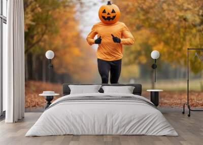 Pumpkin-headed runner strides powerfully against the backdrop of strikingly colored fall foliage during a Halloween marathon  Wall mural