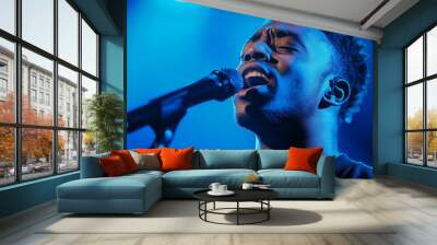 Solo gospel singer in deep concentration microphone close to lips soft spotlight creating dramatic shadows powerful expression of faith  Wall mural