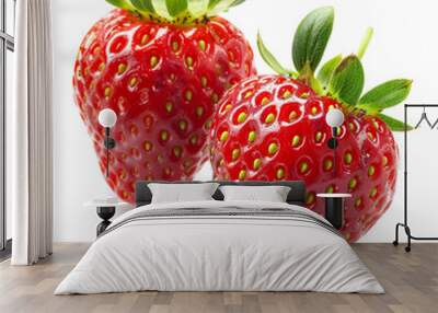 Two fresh, ripe strawberries with vibrant green leaves isolated on a white background, symbolizing healthy summer eating and fruit harvest Wall mural