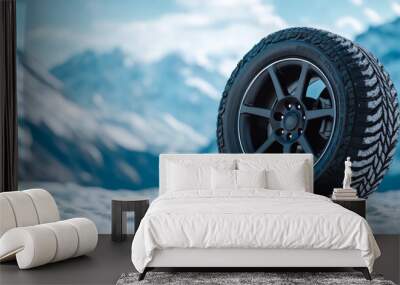 Winter wheels with reflective rims highlighted against a snowy backdrop background highlighting style and function ideal for cold climates  Wall mural