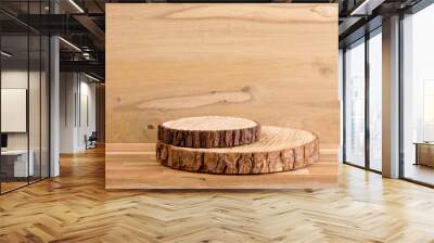 Two pine tree wood discs stacked as a podium for products, natural wood board background with lot of copy space, studio shot. Wall mural