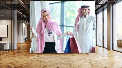 Young muslim couple shopping Wall mural