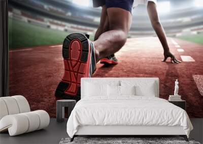 Athlete in starting position Wall mural