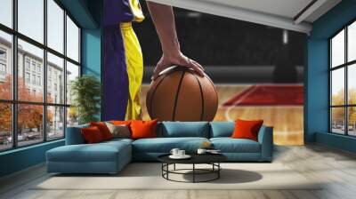 Basketball player holding a ball Wall mural