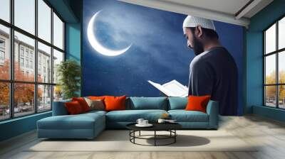 Muslim man reading holy quran Wall mural