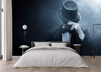 Mysterious man in black suit on dark background Wall mural