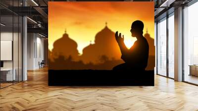 Silhouette of muslim man praying Wall mural