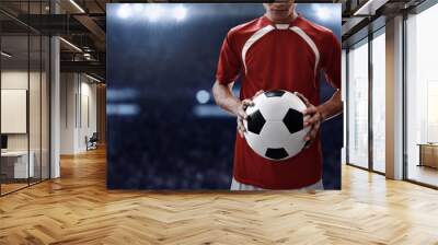 Soccer player holding soccer ball Wall mural