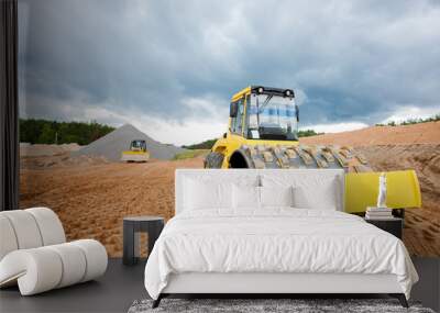 road roller and bulldozer during highway construction works Wall mural