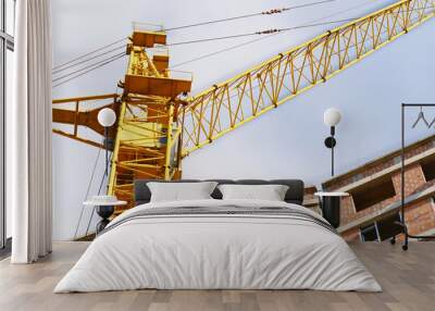 Crane near building. Construction site background. Wall mural