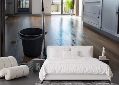  A mop and bucket on a wet floor in a modern kitchen, representing cleaning. _1(100) Wall mural