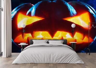 Halloween - old jack-o-lantern on black background Wall mural