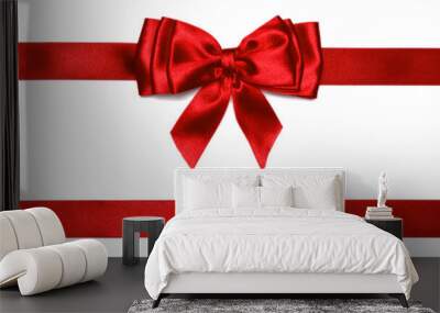 Red shiny bow with ribbons with long ribbon extending on both sides. Wall mural