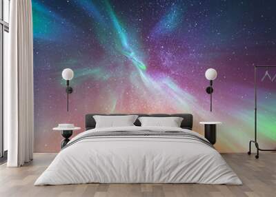 Silhouette of a standing young man with raised up arms on night stars and northern lights Wall mural