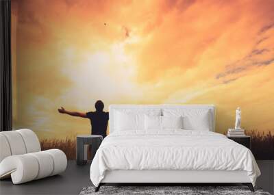 Silhouette of man and sunshine Wall mural