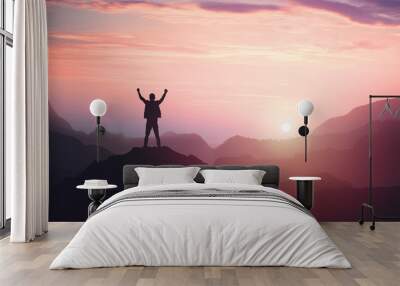 Victorious male person standing on mountain top with arms raised. Winning and success Wall mural