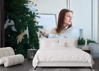 A beautiful woman in a New Year's interior. The concept of New Year and Christmas holidays Wall mural