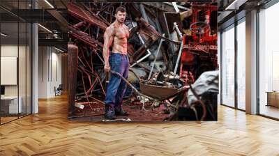 muscular man working on junkyard Wall mural