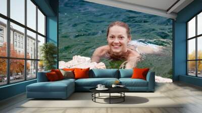 beautiful woman swimming in the sea, close-up portrait Wall mural