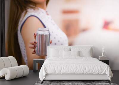 pretty brunette and an blank soda can, focus on drink Wall mural