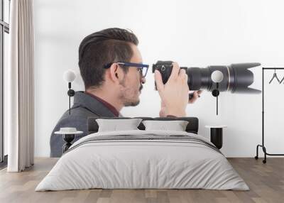 young man in suit taking a photo with professional camera Wall mural