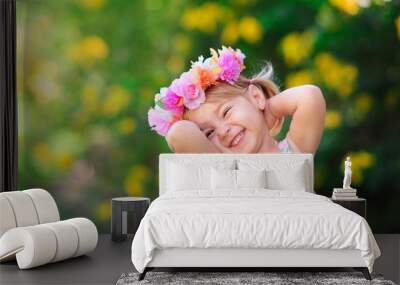 happy smiling child with flower at summer day outdoor Wall mural