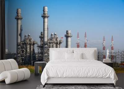 Power plant station building and industrial pipe system on blue sky background Wall mural