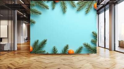 Orange Tangerines and green branches of the Christmas tree on blue background. Ai generated Wall mural