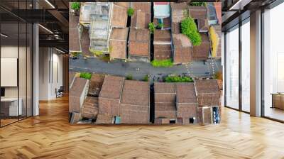 Aerial view of a traditional Vietnamese town with clustered rooftops, capturing local urban life and architectural heritage Wall mural