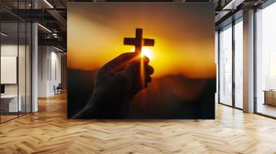 Christian Cross in Hand During Sunset Background Wall mural