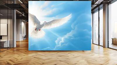 White Dove of Peace in the Air with Wings Wide Open Against Blue Sky Wall mural