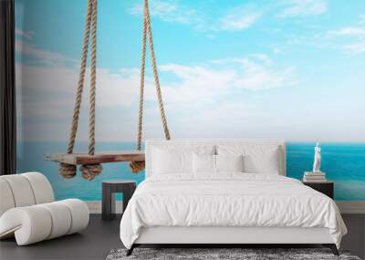 Wooden Swing Against Tropical Ocean Background with Copy Space Wall mural