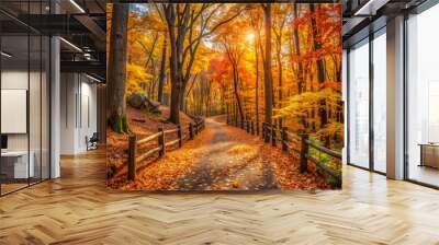 Vibrant autumn foliage surrounds a serene wooded footpath in New Jersey, with golden light illuminating the rustling leaves and scattered fallen trees along the winding trail. Wall mural