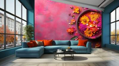 Playful Holi Festival decorations with vibrant powders and flowers on a lively, magenta-hued surface Wall mural