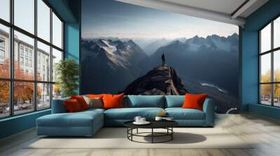 Hiker at the summit of a mountain overlooking a stunning view. Apex silhouette cliffs and valley landscape Wall mural