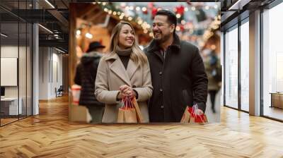 The joyful holiday spirit is captured by a happy couple shopping together at a bustling outdoor market adorned with festive decorations and sparkling lights during the Christmas season Wall mural