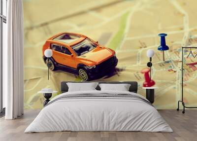 travel concept - small toy car on the map Wall mural