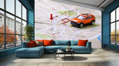 travel concept - small toy car on the map Wall mural