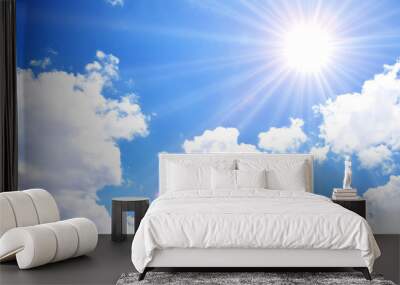 Blue sky with clouds and sun Wall mural