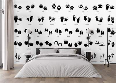 Animals paw prints. Cartoon mammal footprints, black bird foot. Wild animal feet silhouette. Foot paws track tiger, cat and dog trace. Pets trails. Vector set Wall mural