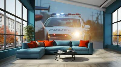 High speed police pursuit on highway. View of cop patrol car chasing a thief on red modern car driving away from the law. Wall mural