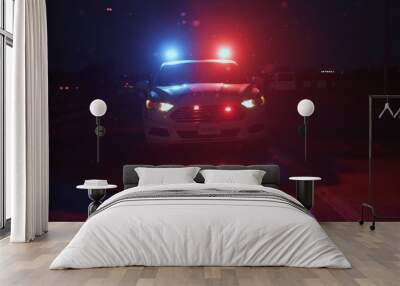 Police patrol car arriving in focus. Front view of policemen driving auto on the highway at night. Police raid in the city. Wall mural