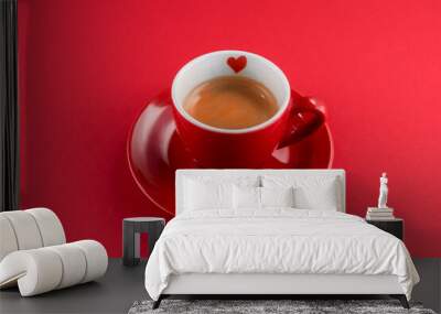 red cup of coffee espresso with little heart on a red background Wall mural